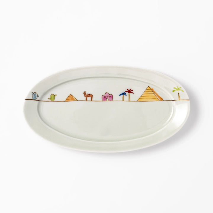 Japanese porcelain oval plate with whimsical Egypt design featuring pyramids, camel, palm trees, and desert-inspired details