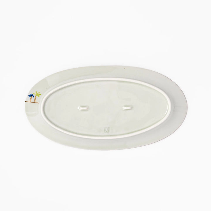 Japanese porcelain oval plate with whimsical Egypt design featuring pyramids, camel, palm trees, and desert-inspired details