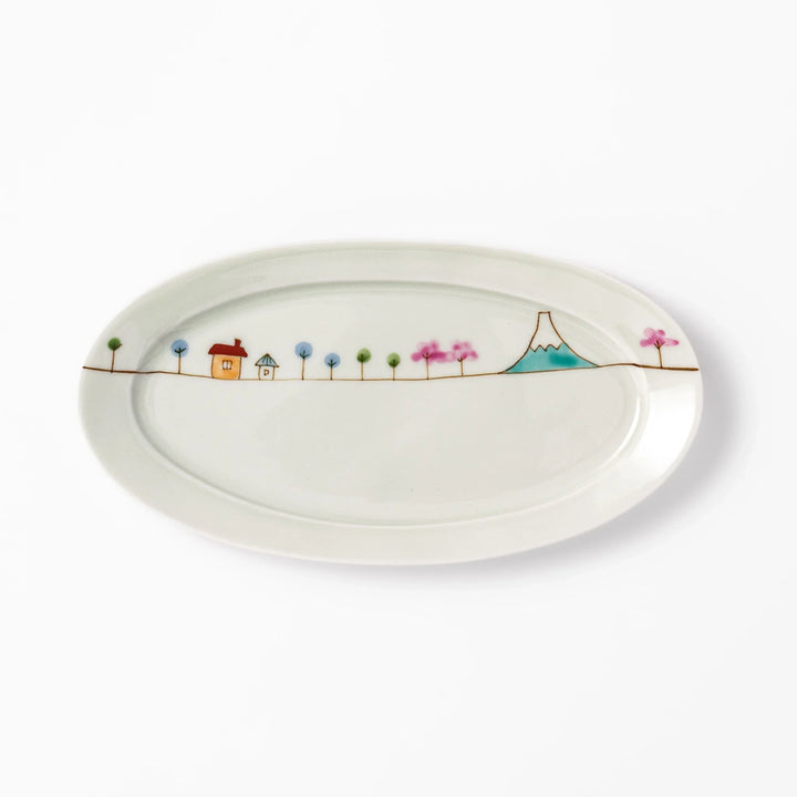 Japanese porcelain oval plate with whimsical Japan design featuring Mount Fuji, cherry blossoms, houses, and colorful trees