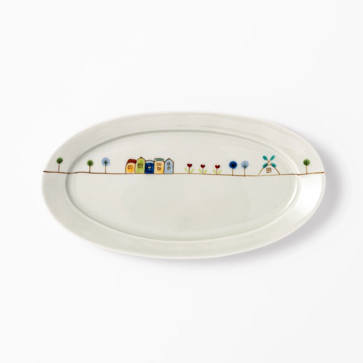 Japanese porcelain oval plate with whimsical Netherlands design featuring colorful houses, tulips, trees, and a blue windmill