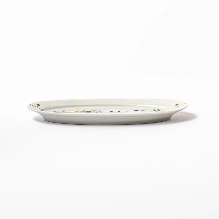 Japanese porcelain oval plate with whimsical Netherlands design featuring colorful houses, tulips, trees, and a blue windmill