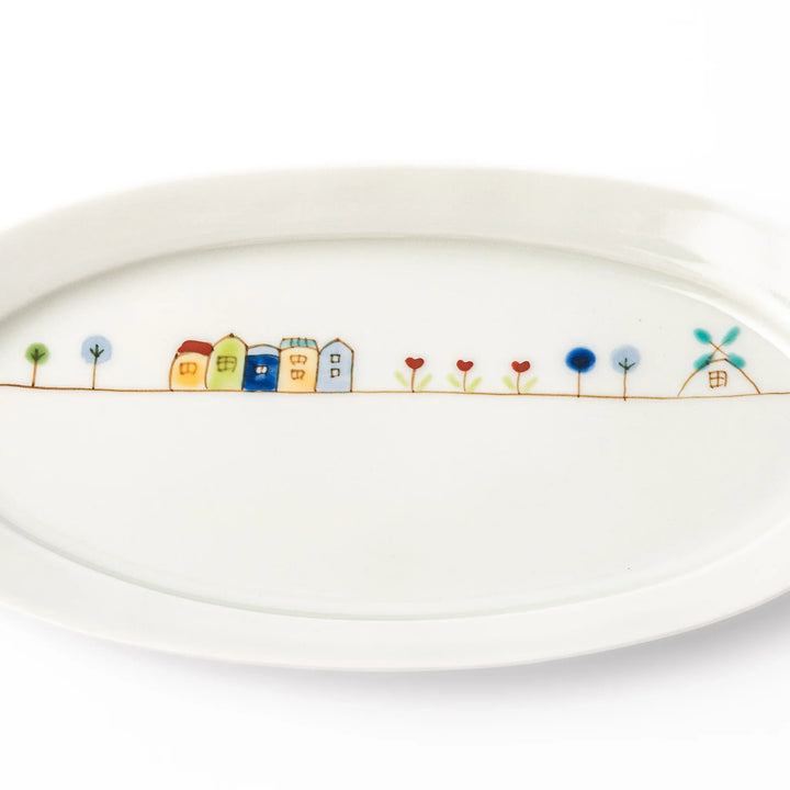 Japanese porcelain oval plate with whimsical Netherlands design featuring colorful houses, tulips, trees, and a blue windmill