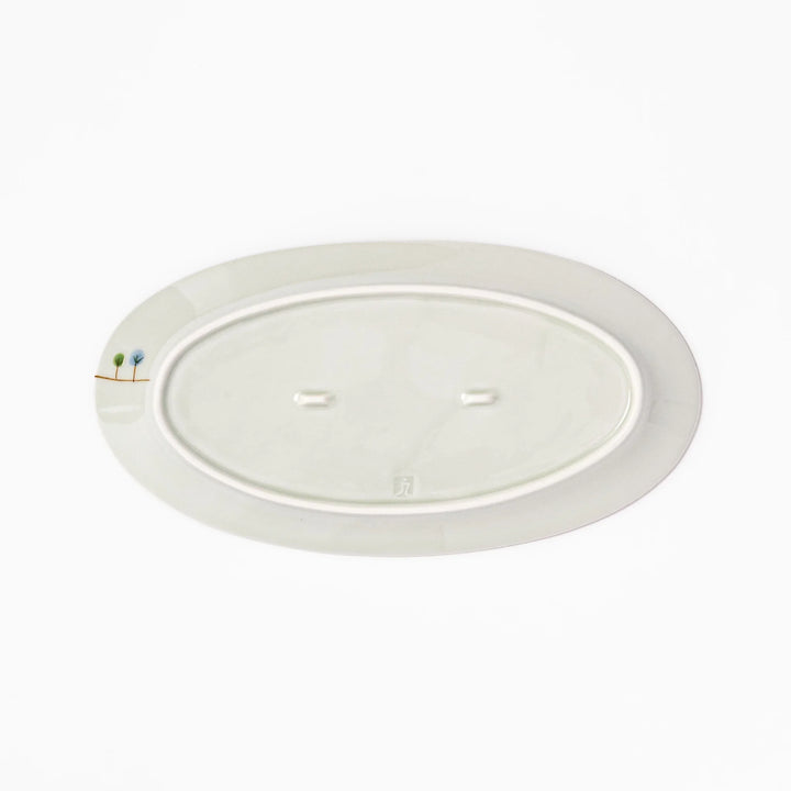 Japanese porcelain oval plate with whimsical Netherlands design featuring colorful houses, tulips, trees, and a blue windmill