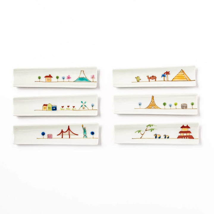 Set of six Japanese porcelain chopstick rests with whimsical world landmark designs including USA, Japan, France, and Egypt