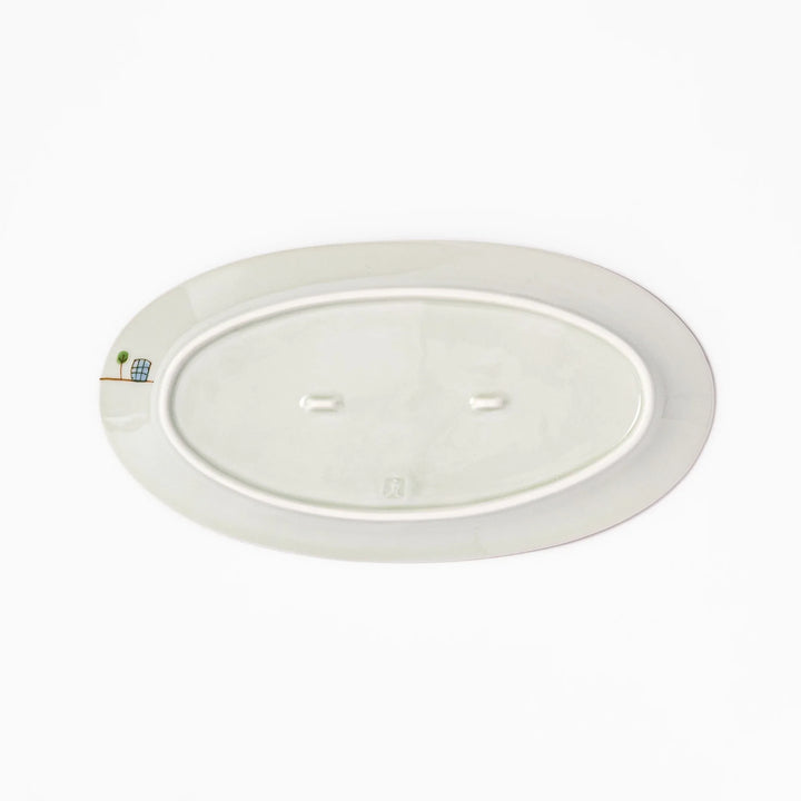 Japanese porcelain oval plate with playful USA cityscape design featuring Statue of Liberty, bridge, and colorful buildings