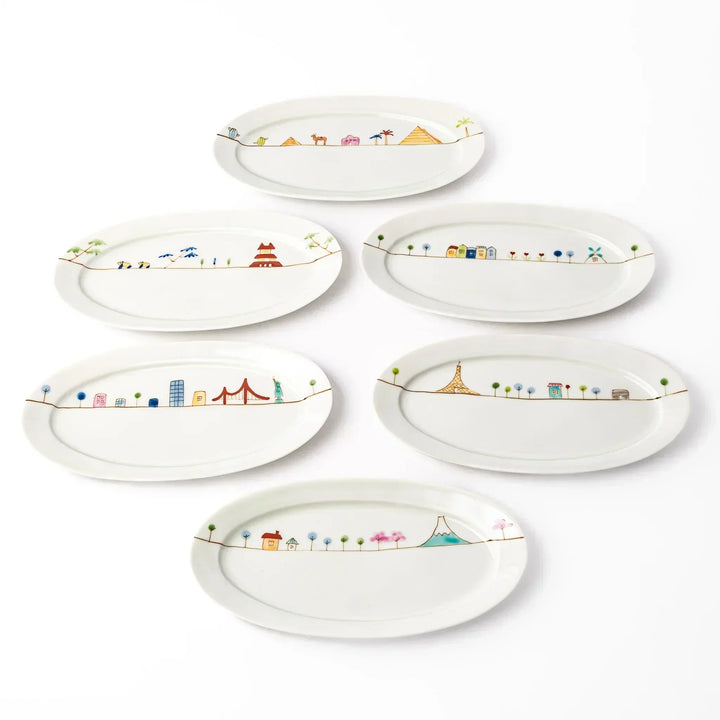 Set of six Japanese porcelain oval plates featuring colorful storybook-style world landmarks and whimsical travel-inspired designs