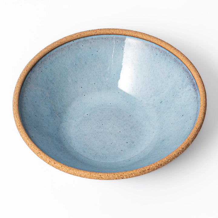 Terracotta blue ceramic cereal bowl with rustic brown rim, handcrafted in Japan for serving cereal, salad, soup, or everyday meals.