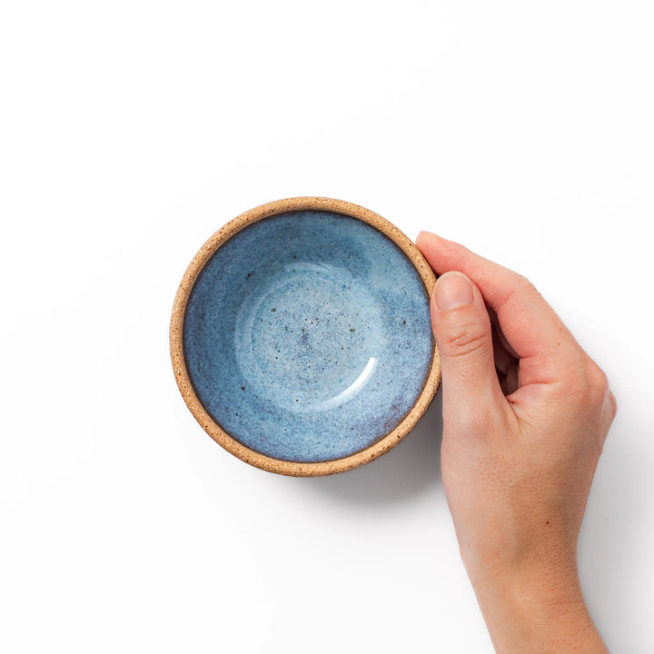 Terracotta blue ceramic dessert bowl with rustic brown rim, handcrafted in Japan for serving ice cream, fruit, soup, or side dishes.