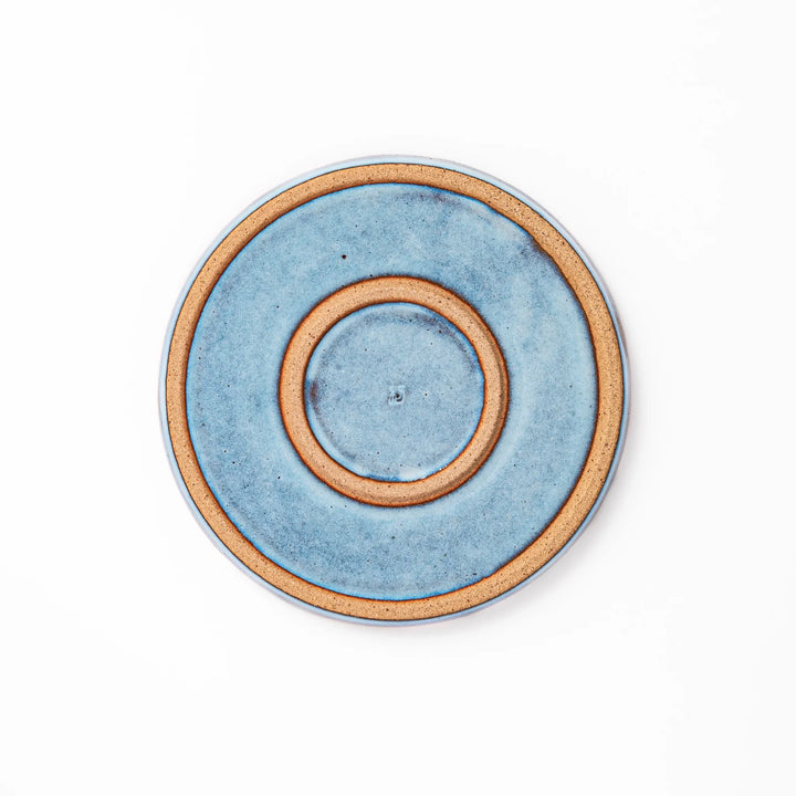 Terracotta blue ceramic dessert plate with rustic brown rim, handcrafted in Japan for serving cake, pastry, appetizers, or everyday meals.
