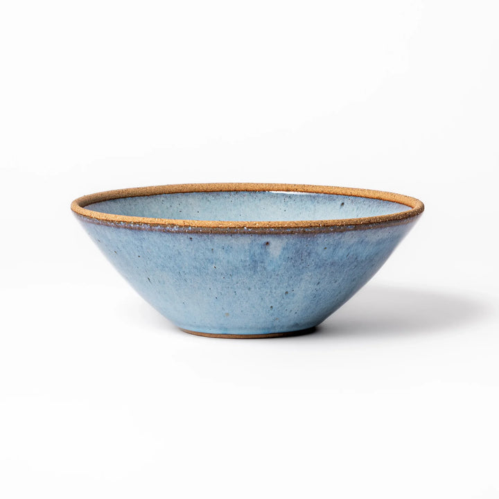Terracotta blue ceramic pasta bowl with rustic brown rim, handcrafted in Japan for serving pasta, curry, salad, or versatile everyday meals.
