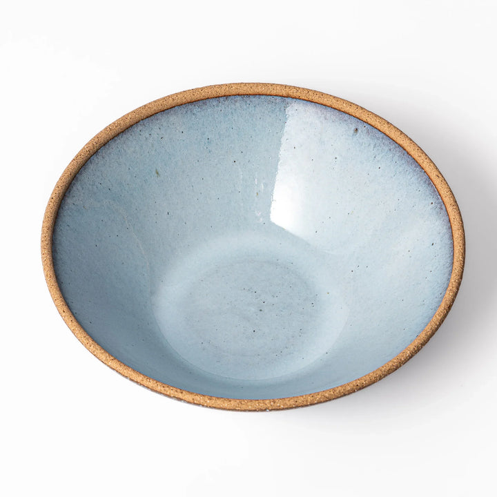 Terracotta blue ceramic pasta bowl with rustic brown rim, handcrafted in Japan for serving pasta, curry, salad, or versatile everyday meals.