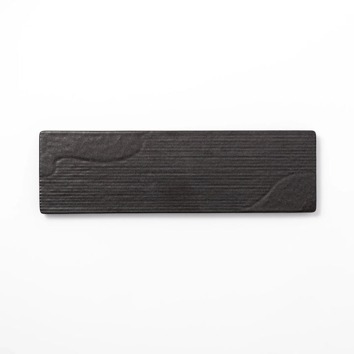 Rectangular black ceramic serving plate with a subtle ridged woodgrain texture, perfect for stylish Japanese meals and contemporary plating.