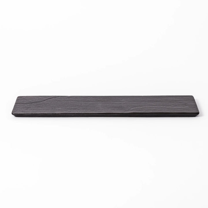 Rectangular black ceramic serving plate with a subtle ridged woodgrain texture, perfect for stylish Japanese meals and contemporary plating.