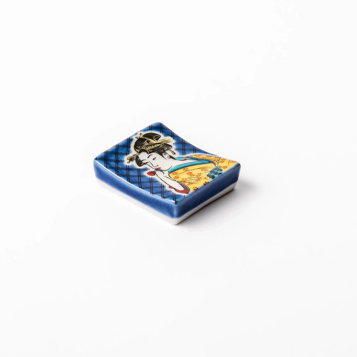 Rectangular Japanese ceramic chopstick rest featuring an elegant courtesan in traditional kimono, inspired by Utamaro’s ukiyo-e artistry, perfect for table decor.