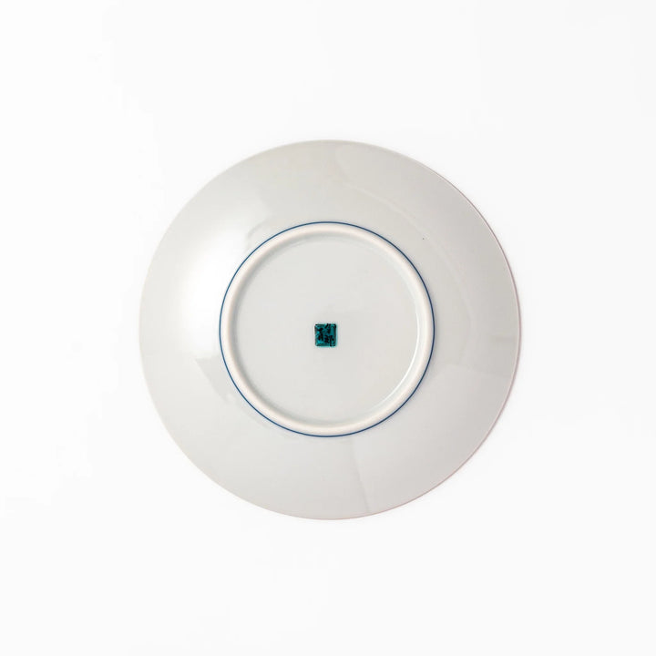 Japanese porcelain dessert plate with bold yellow peony blooms, green leaves, and brown branches on a white background