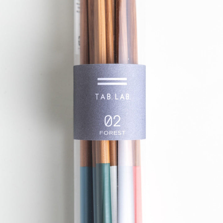 A set of wooden chopsticks with vibrant colored tops in various shades, including yellow, blue, orange, green, and white.