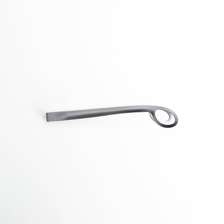 Curved stainless steel tongs with holes at the end for drainage