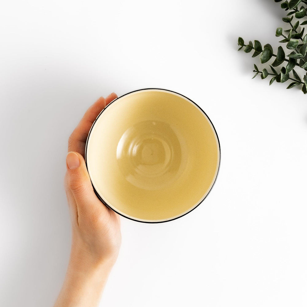 Eye-catching Matcha bowl showcasing a beautiful floral pattern in white and green against a bright blue backdrop, ideal for preparing and serving Matcha.