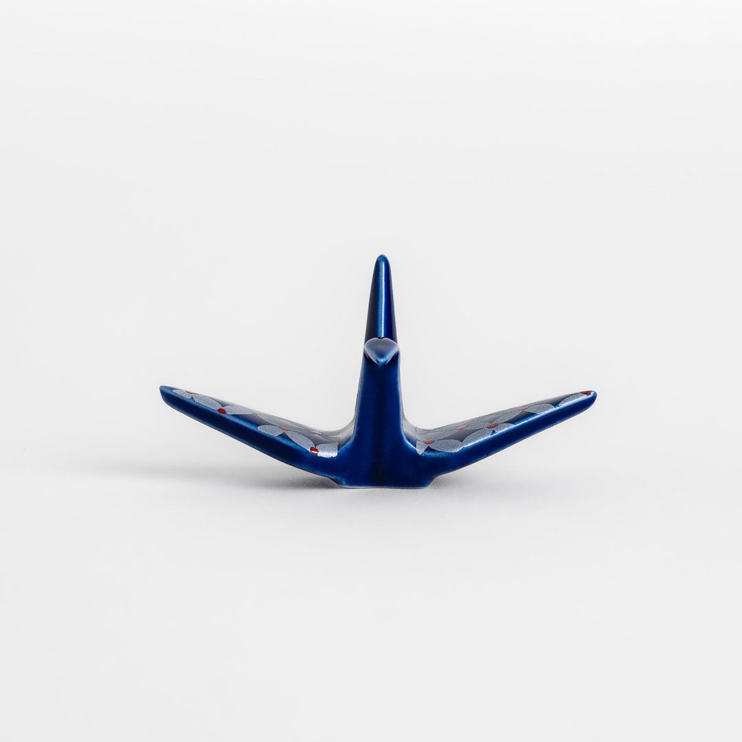 Blue origami crane incense holder with a geometric silver and red pattern, adding a unique, artistic touch to your space.