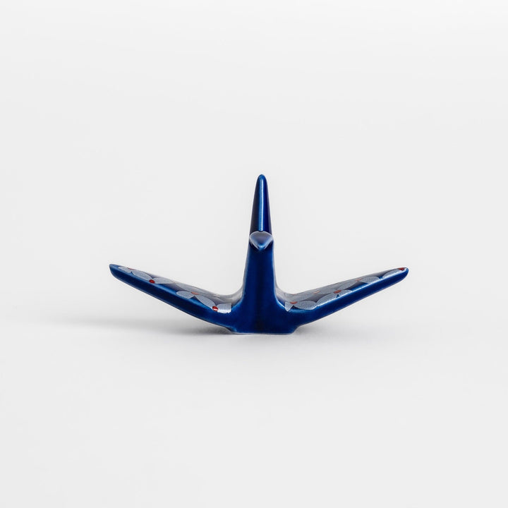 Blue origami crane incense holder with a geometric silver and red pattern, adding a unique, artistic touch to your space.