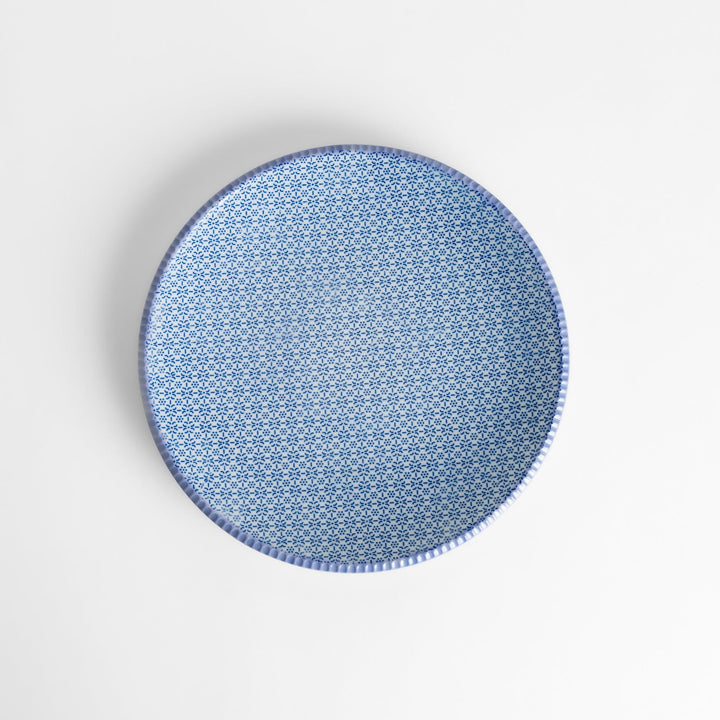 Blue and white floral patterned Dinner Plate with a subtle striped rim, offering an elegant touch for refined dining presentations.
