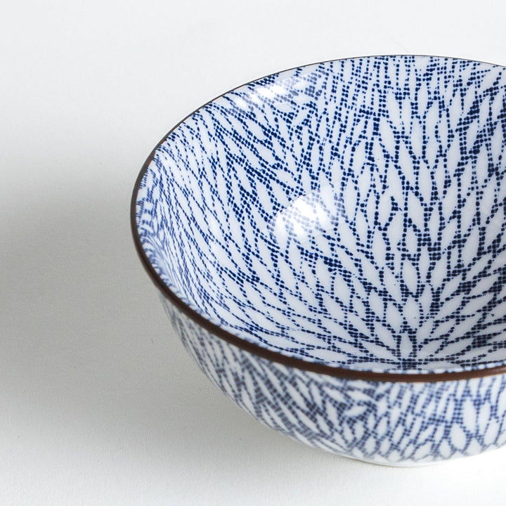 Close-up shot highlighting the delicate blue chrysanthemum leaves pattern within the bowl.