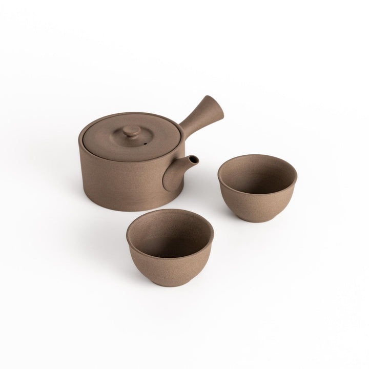 Elegant gray tea set featuring a round teapot with spout and matching bowls, perfect for enjoying your favorite tea in style.