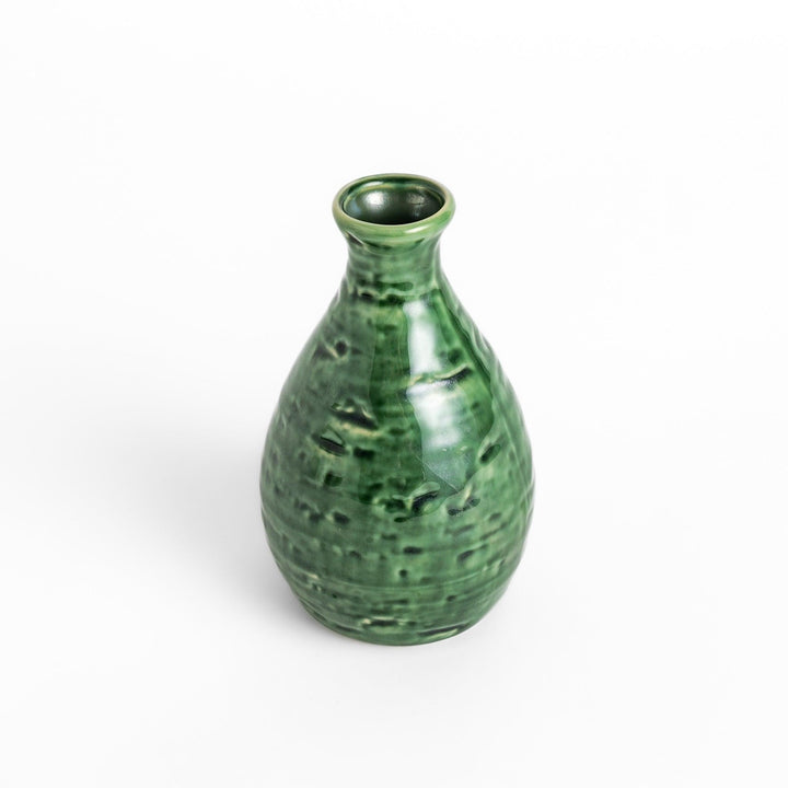 Glossy deep green ceramic sake flask with a textured finish and classic silhouette, perfect for serving traditional warm or chilled sake.