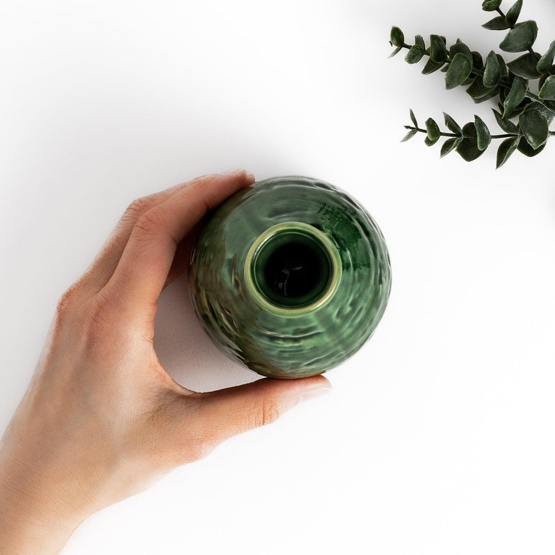 Deep green sake flask with a textured, glossy finish, shaped in a traditional style, ideal for serving sake with elegance and charm.
