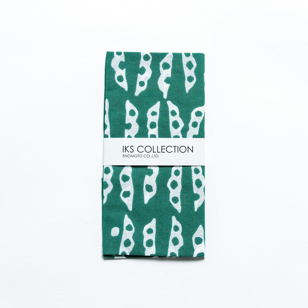 Folded green tenugui featuring edamame pod patterns, neatly wrapped with a product sleeve