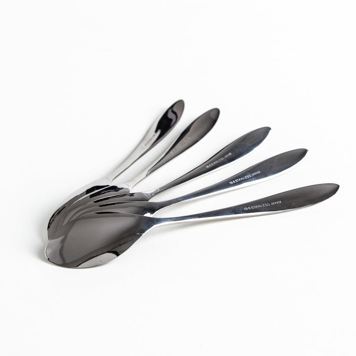 A set of stainless steel spoons placed in a fan-like arrangement, each spoon displaying its engraved brand name.