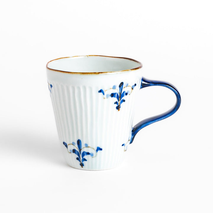 Elegant floral leaves mug with blue floral patterns and a blue handle, featuring a delicate ribbed design and gold trim for a classic, refined look.