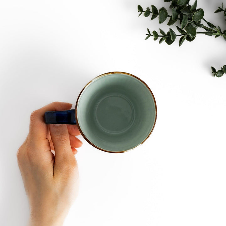 Elegant floral leaves mug with blue floral patterns and a blue handle, featuring a delicate ribbed design and gold trim for a classic, refined look.