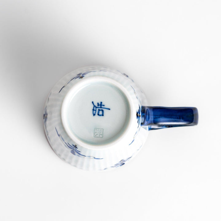 Elegant floral leaves mug with blue floral patterns and a blue handle, featuring a delicate ribbed design and gold trim for a classic, refined look.