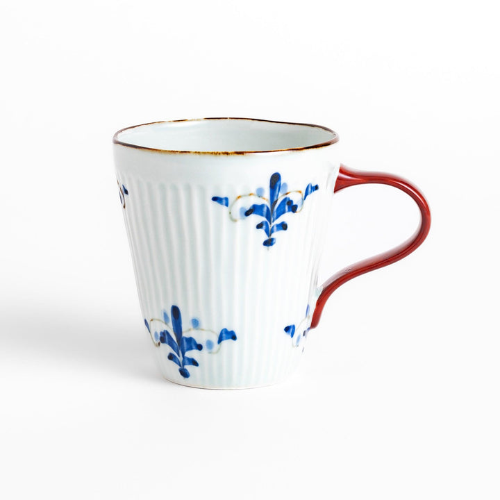 Charming floral leaves mug with intricate blue floral patterns, complemented by a red handle and gold trim, adding a touch of elegance to your tea time.