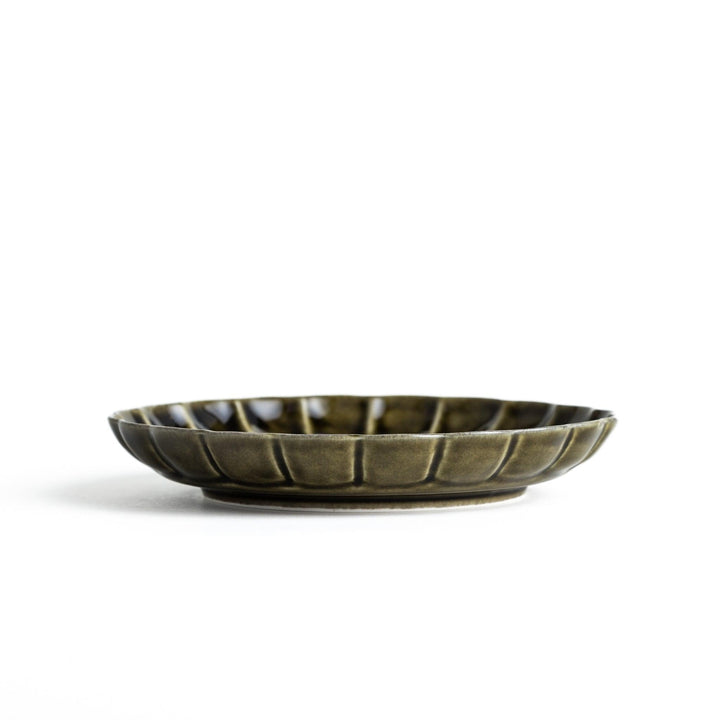 Round, dark brown or olive colored dessert plate with a scalloped edge, featuring a glossy finish.