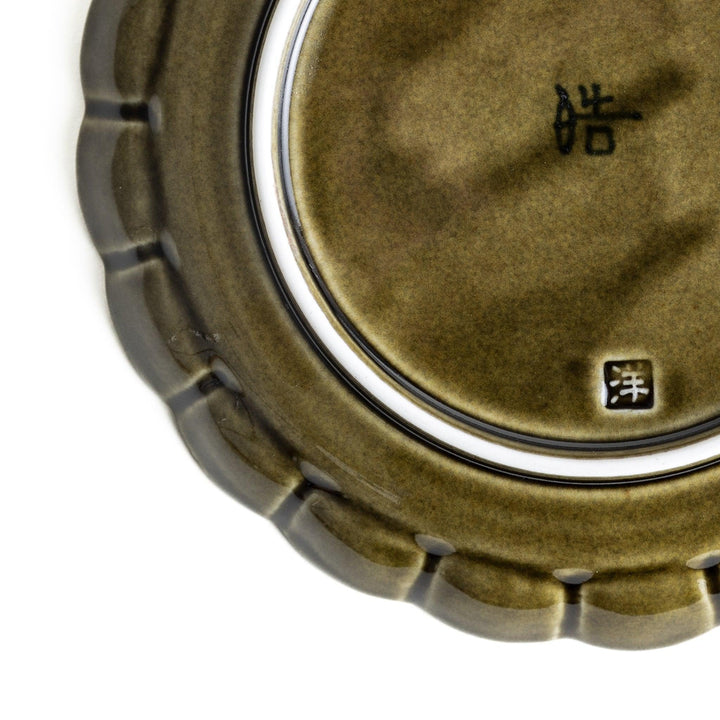 Round, dark brown or olive colored dessert plate with a scalloped edge, featuring a glossy finish.