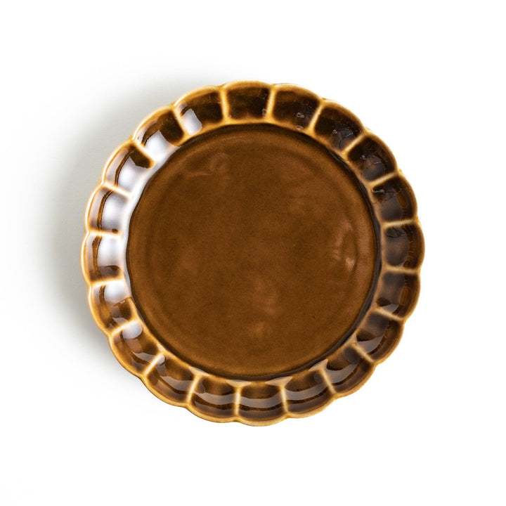 Round, dark brown or olive colored dessert plate with a scalloped edge, featuring a glossy finish.
