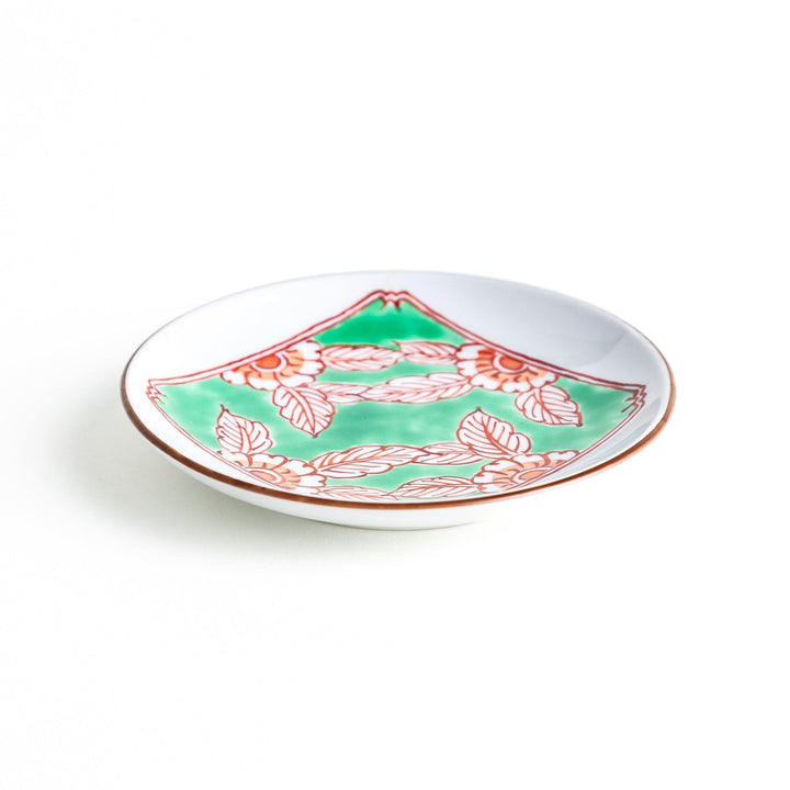 Round plate with green Mt. Fuji pattern and orange floral design.