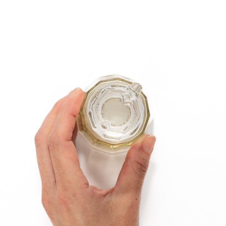 Elegant soy sauce dispenser with a frosted plum blossom design, featuring a smooth pour spout and an intricate geometric base.