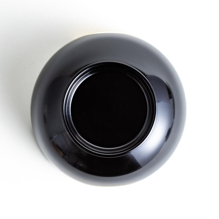 Traditional black lacquer bowl with a golden moon motif on the exterior, featuring a smooth, glossy finish.