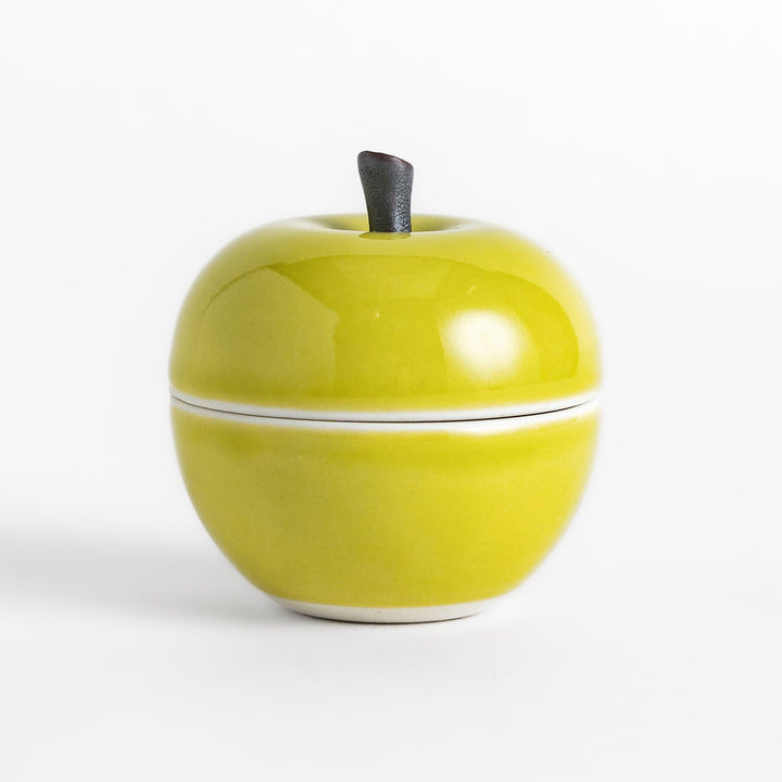 Green Apple Lidded Condiment Bowl, a charming ceramic bowl with a glossy green finish and a small black stem, perfect for serving sauces and condiments.