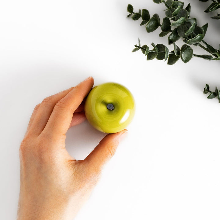 Green Apple Lidded Condiment Bowl, a charming ceramic bowl with a glossy green finish and a small black stem, perfect for serving sauces and condiments.