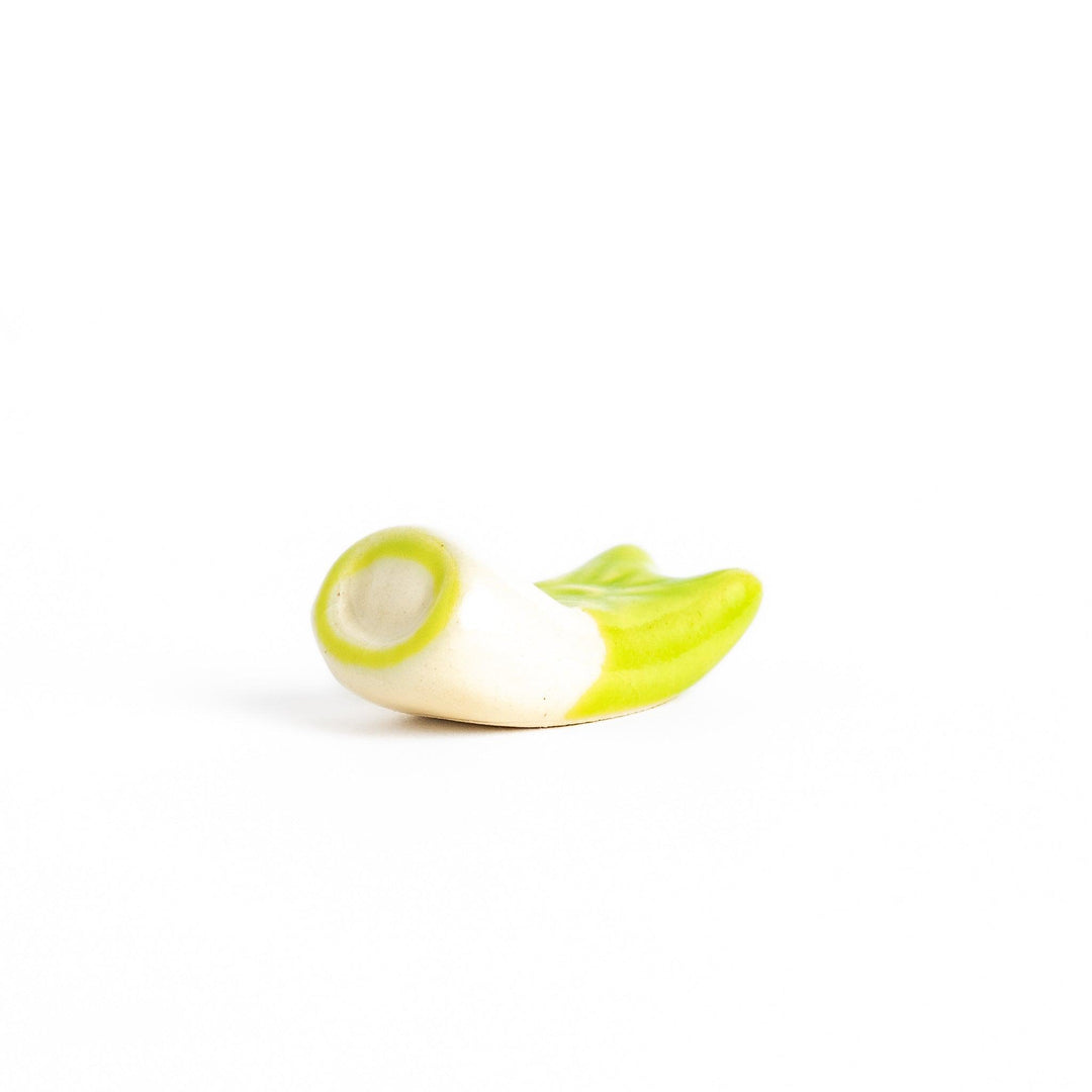 Green carp streamer chopstick rest with a playful yellow eye design.