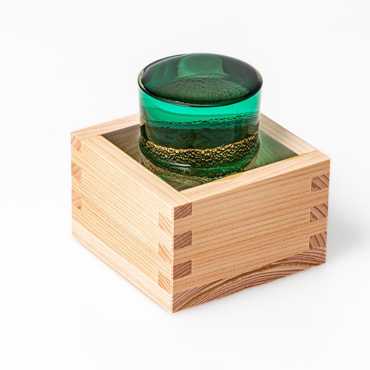 Traditional hinoki wood masu sake cup with visible joinery, offering a natural aroma and authentic way to enjoy Japanese sake or serve condiments.