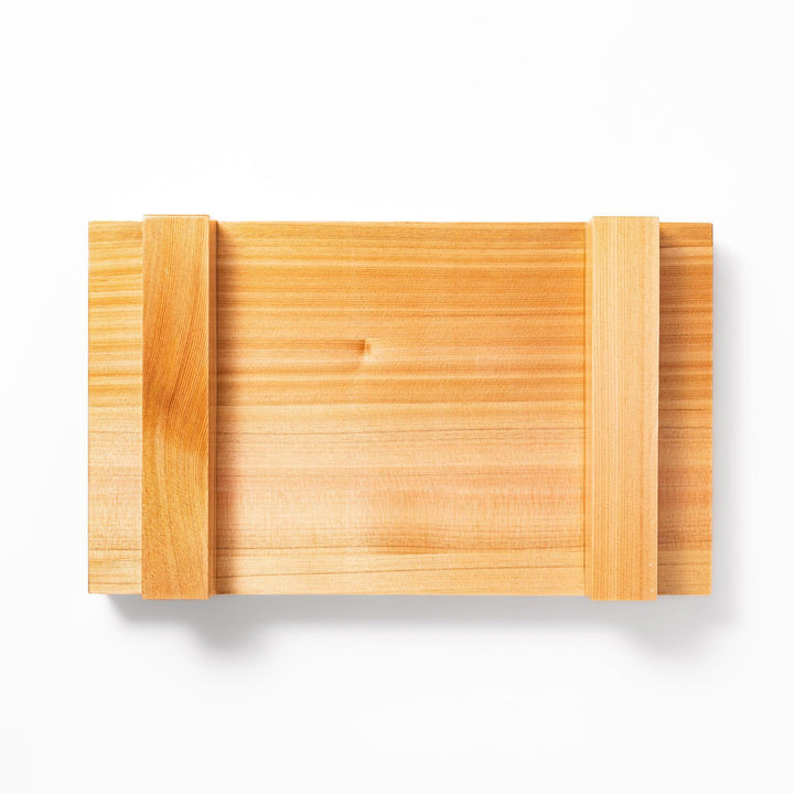 Elevated hinoki wood sushi plate with traditional joinery and natural grain, ideal for presenting sushi or appetizers with refined Japanese style.