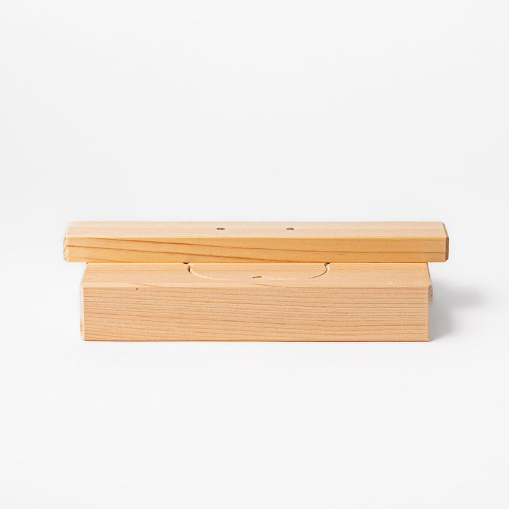 Hinoki wood onigiri mold in a plum blossom shape, ideal for pressing rice into floral forms with a gentle aroma and traditional Japanese charm.