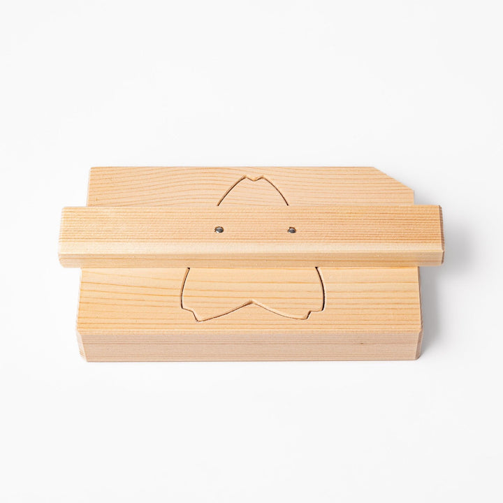 Hinoki wood onigiri mold in a sakura shape, designed for pressing rice into flower forms with a natural aroma and traditional Japanese charm.