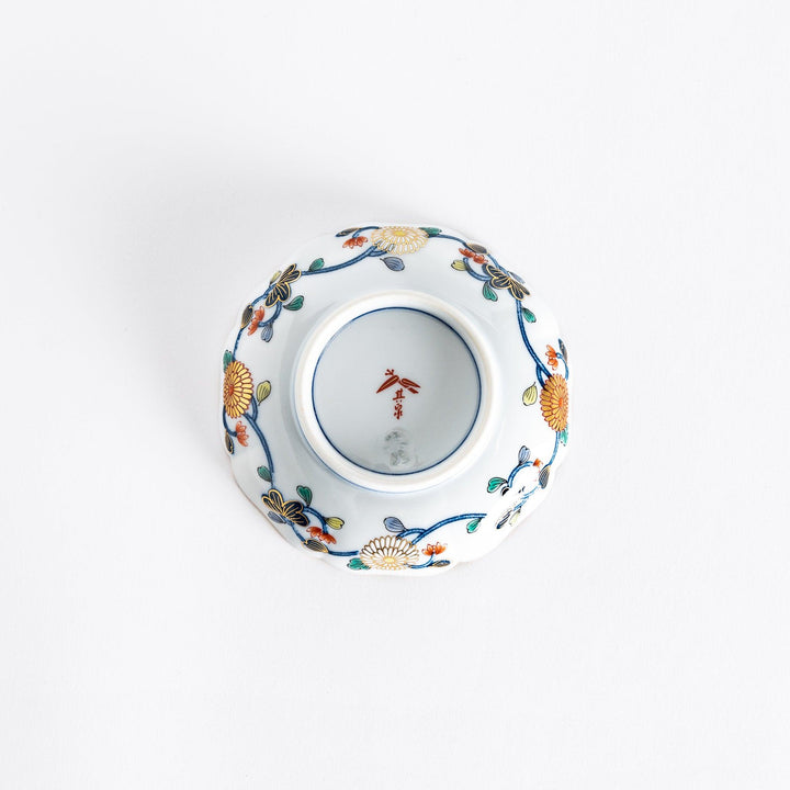 Bottom view of the Imperial Blossom sauce dish, showing the smooth white porcelain and any maker's mark beneath the dish.