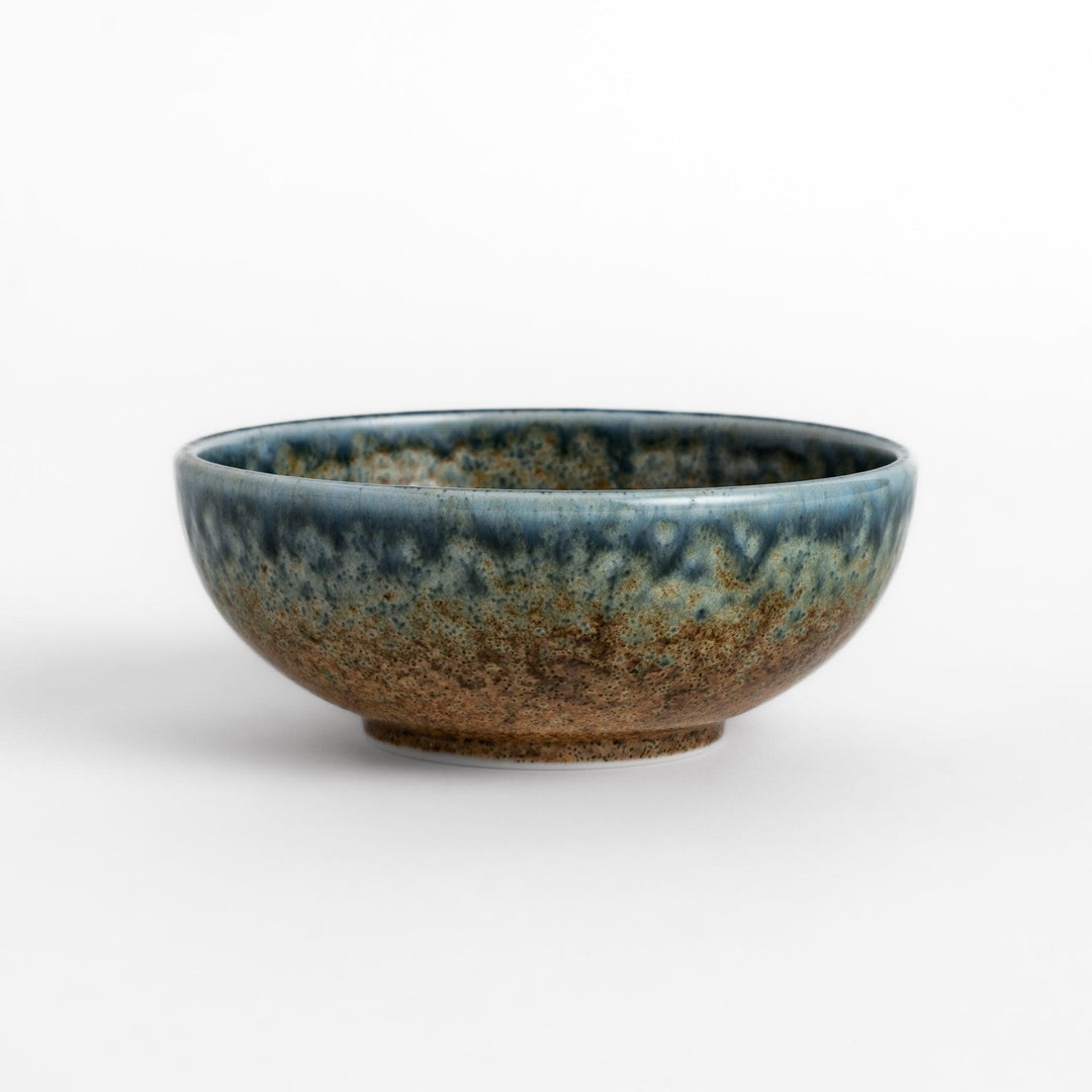 Dessert bowl featuring a beautiful indigo glaze with a stunning ombré effect, transitioning from deep blue to earthy brown